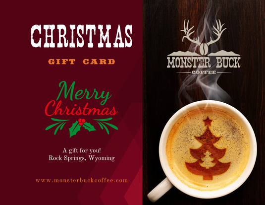 A christmas monster buck coffee gift card with a cup of coffee with a christmas tree on it.